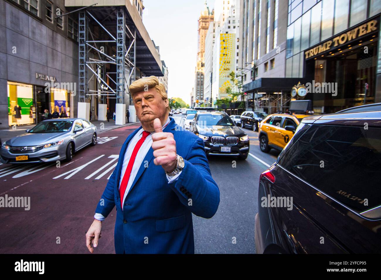 A person in a Donald Trump costume giving a thumbs-up gesture on the ...