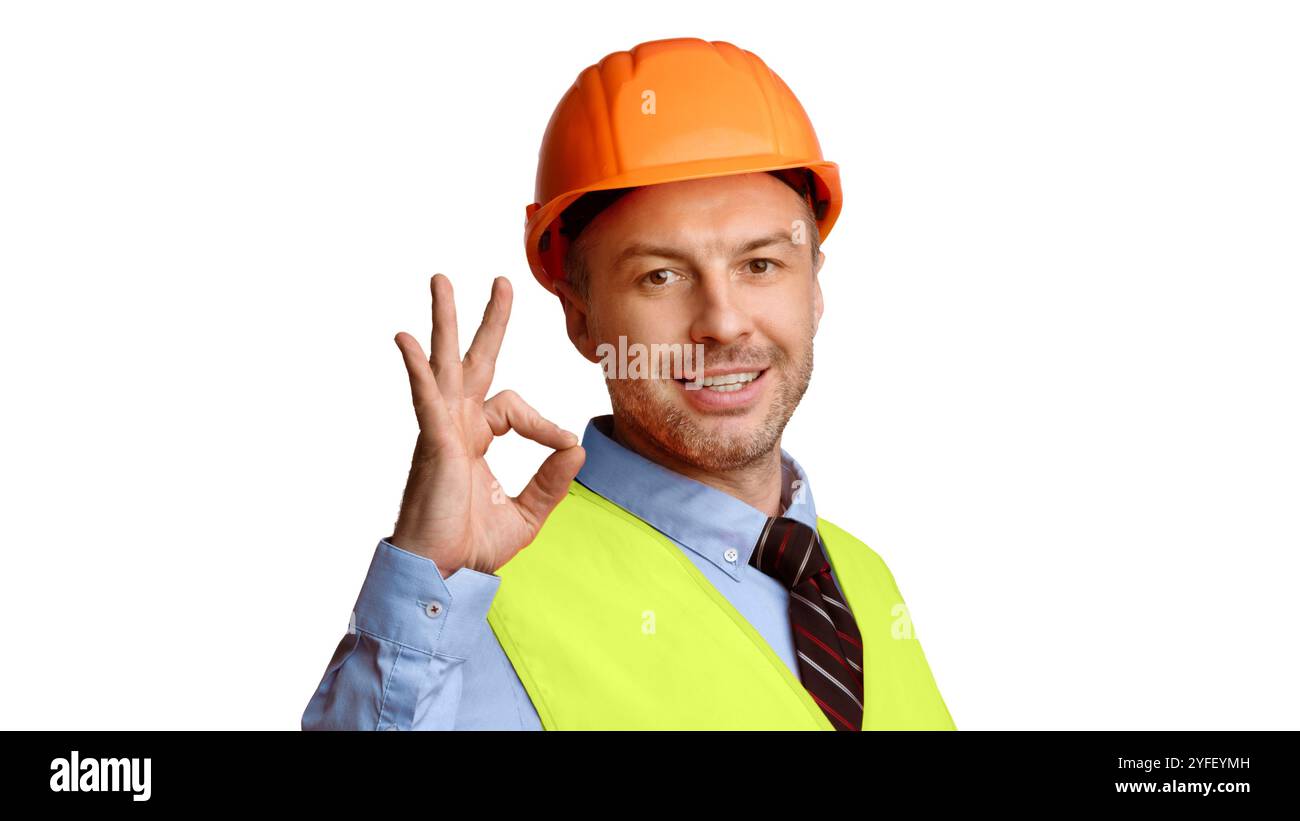Cheerful Builder In Uniform Gesturing Ok On White Background, Panorama Stock Photo