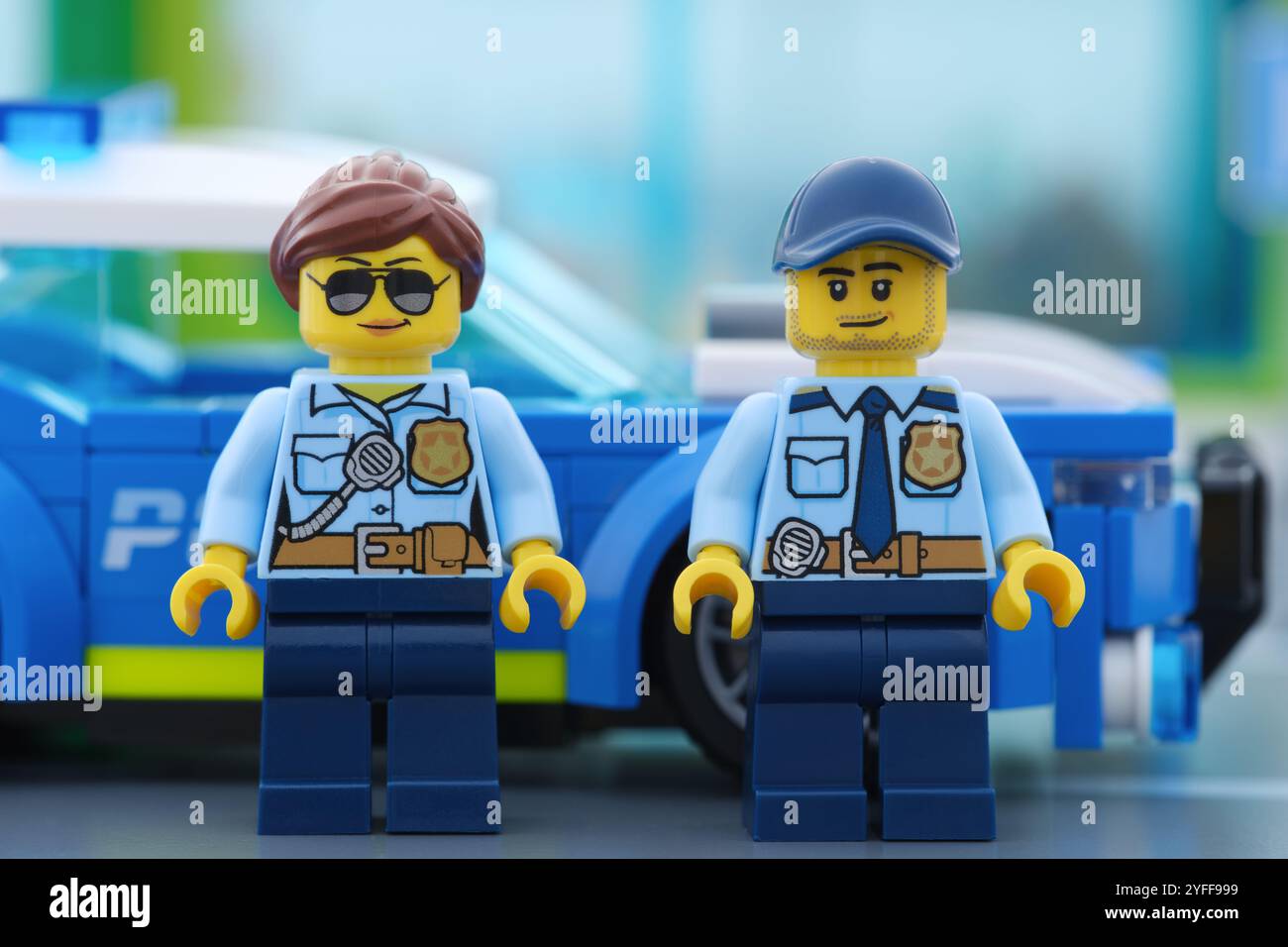 Tambov, Russian Federation - November 04, 2024 Lego police minifigures standing next to a police car. Stock Photo