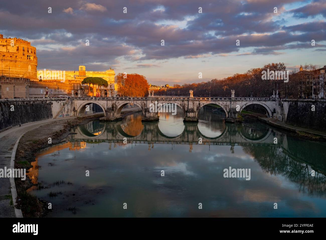 St. Angelo Bridge, Rome, Lazio. The Mausoleum of Hadrian or Castel Sant Angelo at sunset, Italy Stock Photo