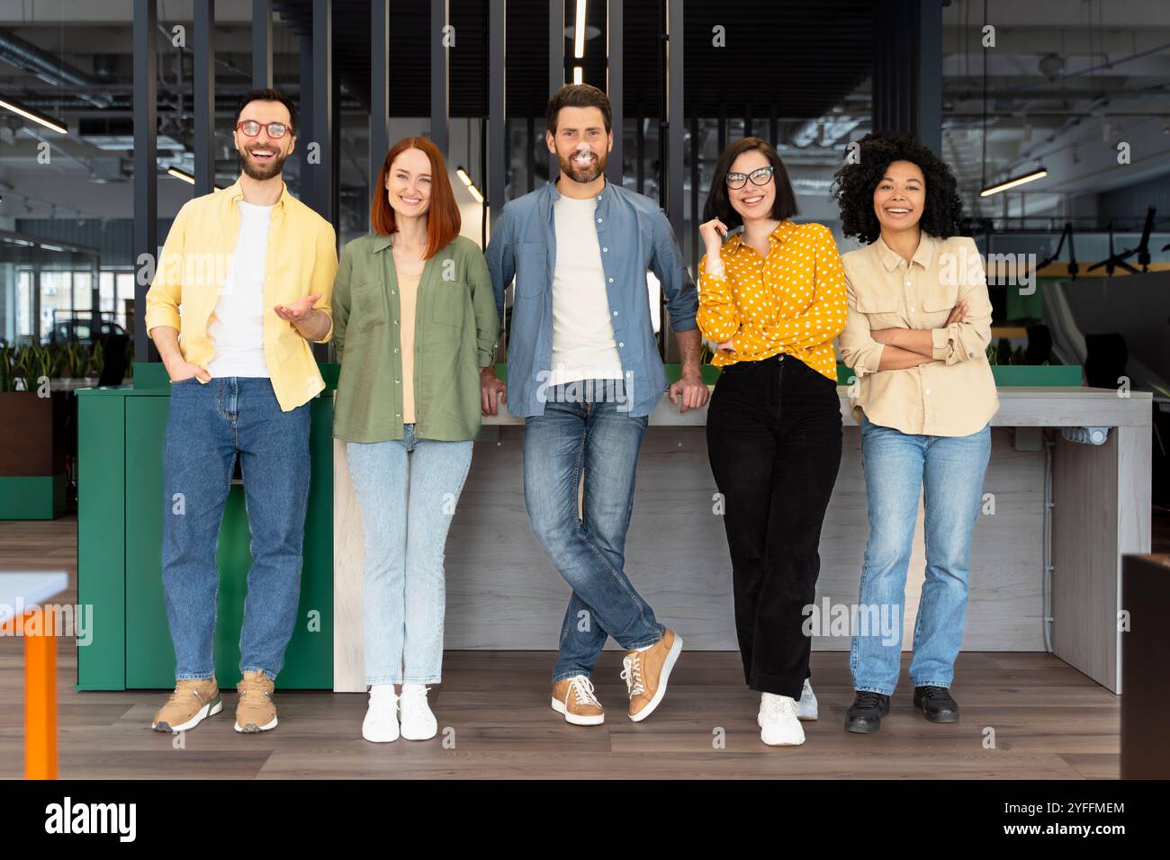Five colleagues posing hi-res stock photography and images - Alamy
