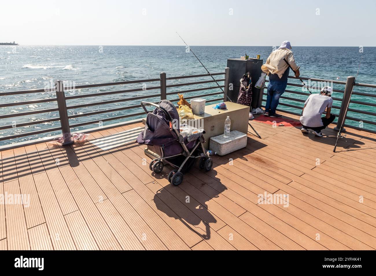 JEDDAH, SAUDI ARABIA - NOVEMBER 16, 2021: Fishermen at corniche promenade in Jeddah, Saudi Arabia Stock Photo