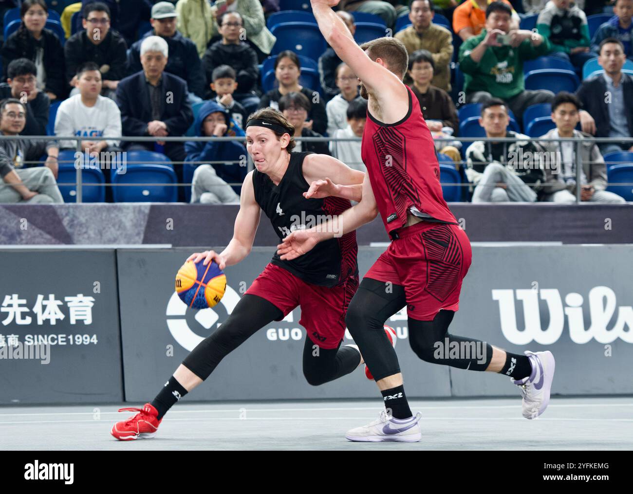 Chinese Wuxi cultural and tourism team member Vuk Borovi ć anin (left) dribbled the ball and broke through. Deqing,China.2nd November 2024. The 2024 FIBA Three Person Basketball Challenge Deqing Station kicks off in Deqing County, Huzhou, Zhejiang Province, on the evening of November 2, 2024, attracting 14 top teams from around the world to participate. Credit: Guo Tianqi/China News Service/Alamy Live News Stock Photo