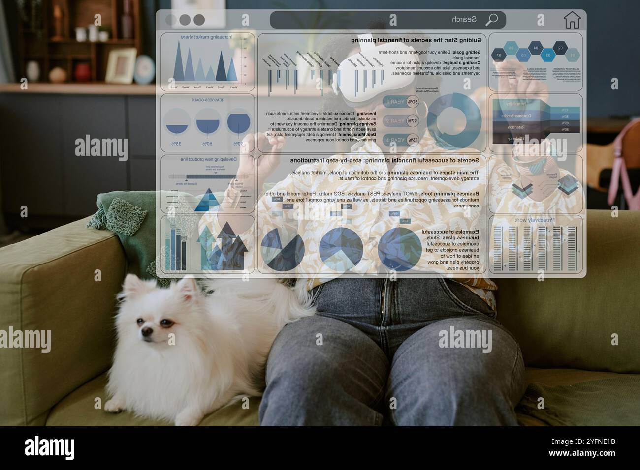 Using Virtual Reality While Sitting on Couch with Dog Stock Photo