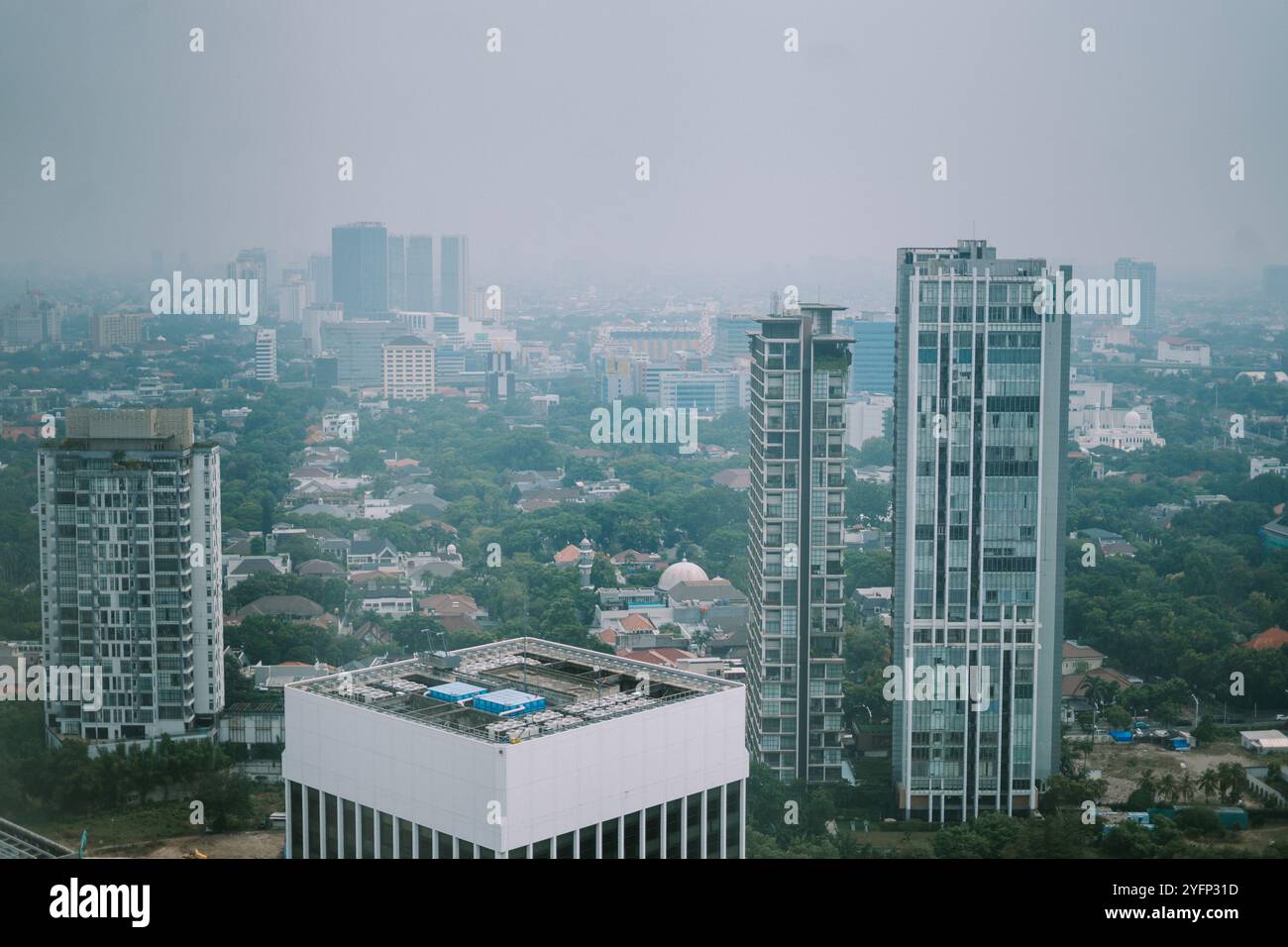 high-rise-buildings-and-a-major-road-in-jakarta-city-with-visible-air