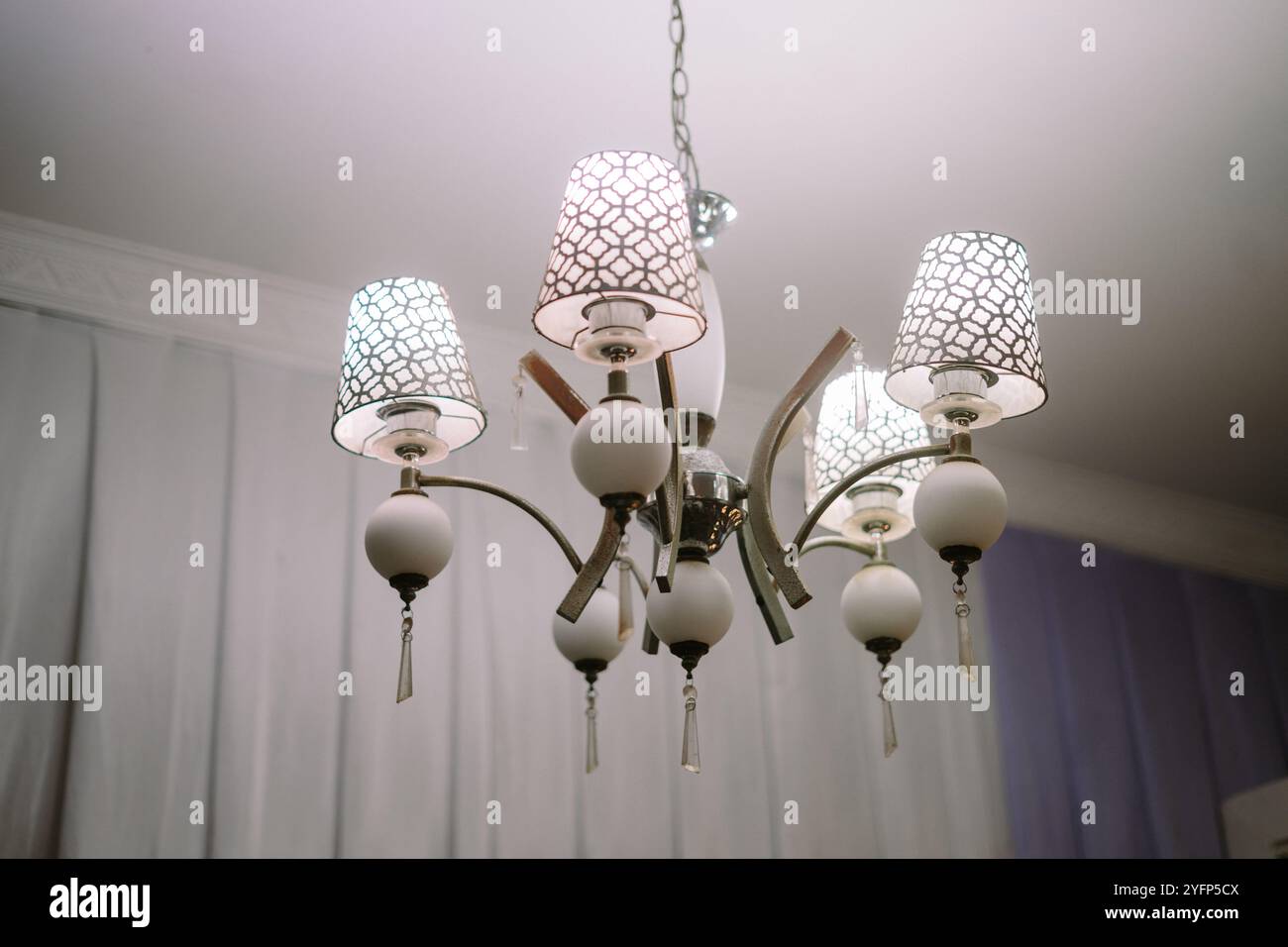 Elegant luxury chandelier illuminating a home interior, adding a touch ...