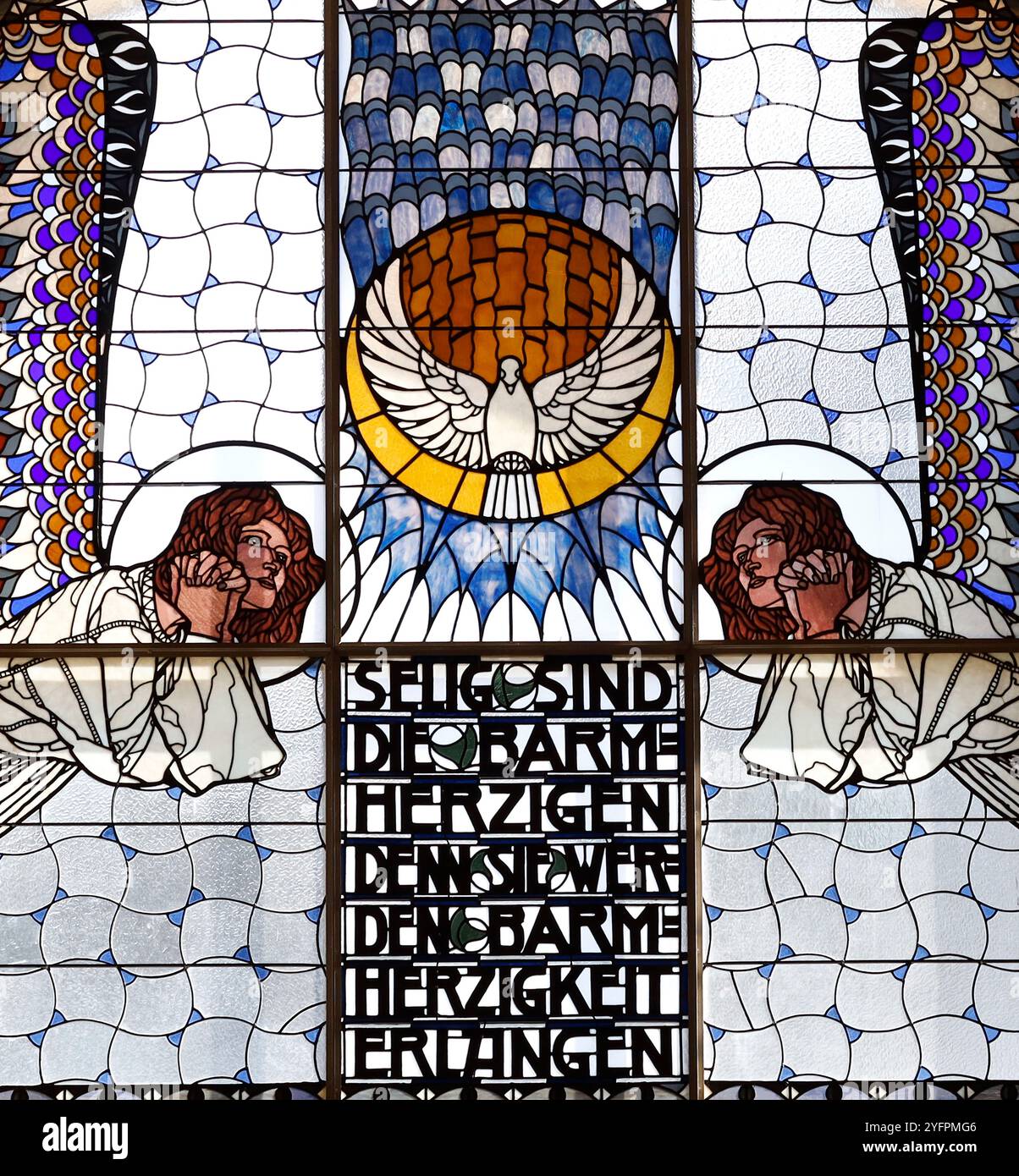 Am Steinhof church (church Leopld) designed by Otto Wagner between 1902 and 1907.  Stained glass by Koloman Moser.  Angels with Holy Spirit.  Art Nouv Stock Photo