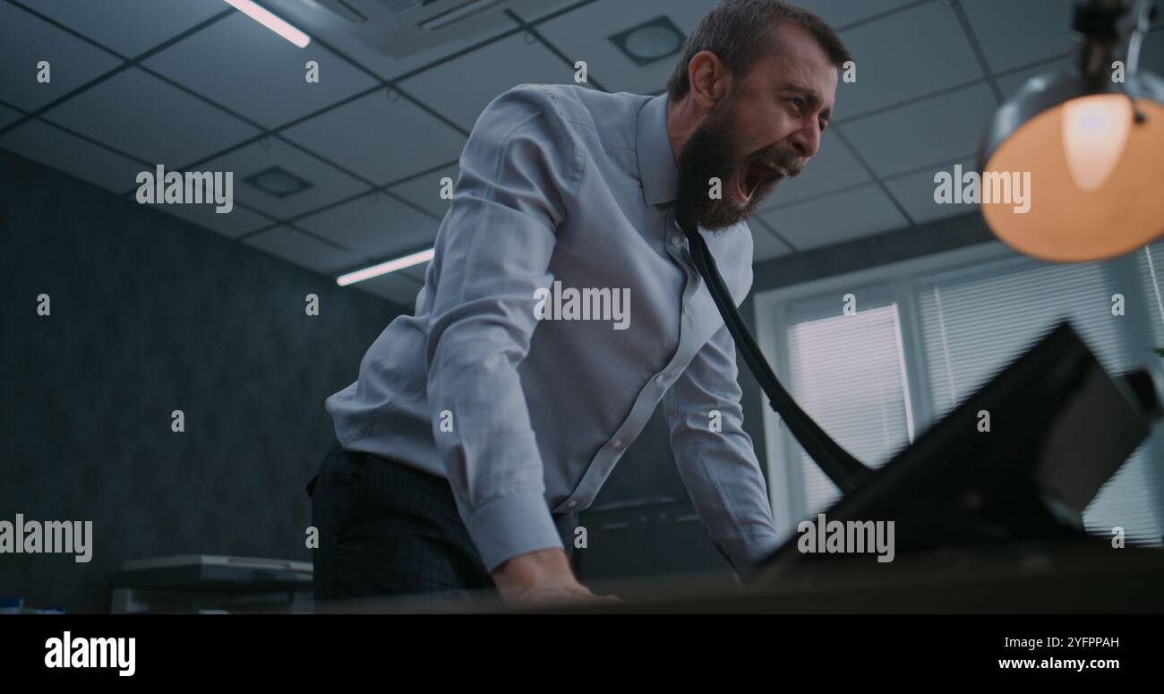 Angry businessman throwing keyboard hi-res stock photography and images ...
