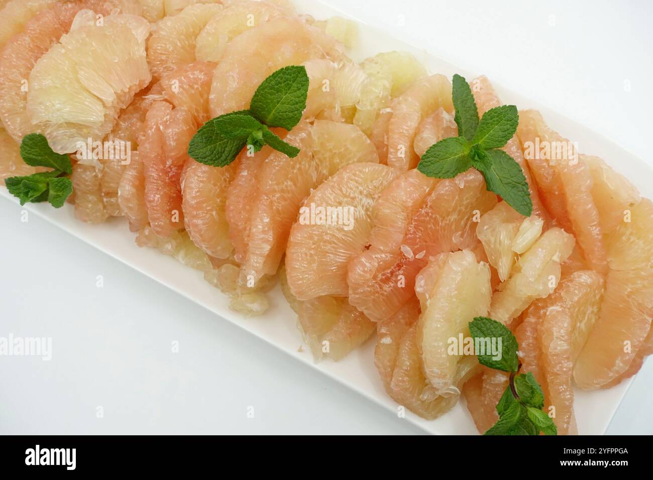 Plate of pomelo or Chinese grapefruit.  France. Stock Photo