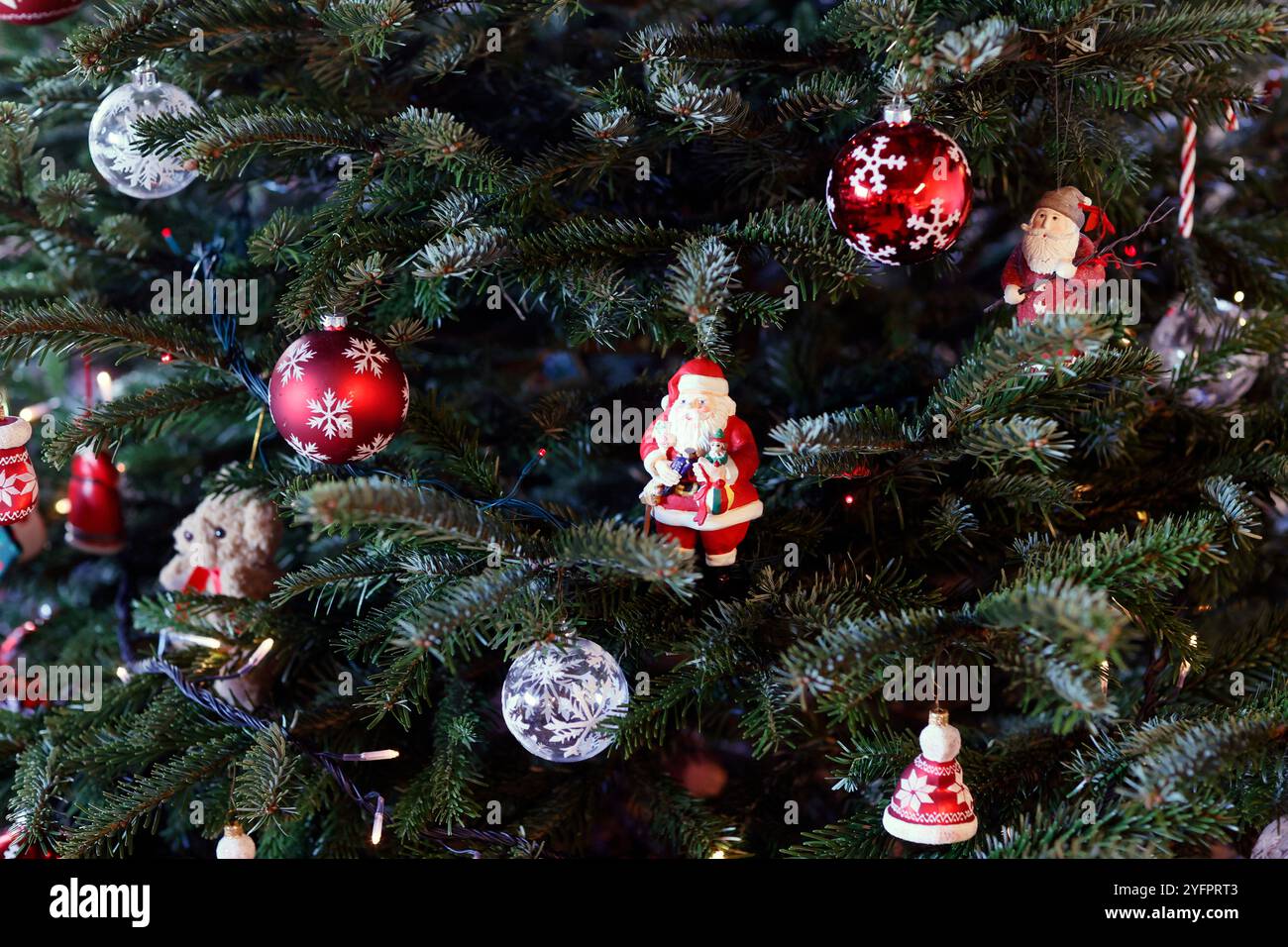 Christmas tree decorated with ornaments. Stock Photo