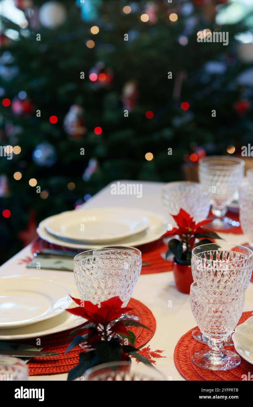 Table served for Christmas dinner in living room. Christmas celebration; Stock Photo