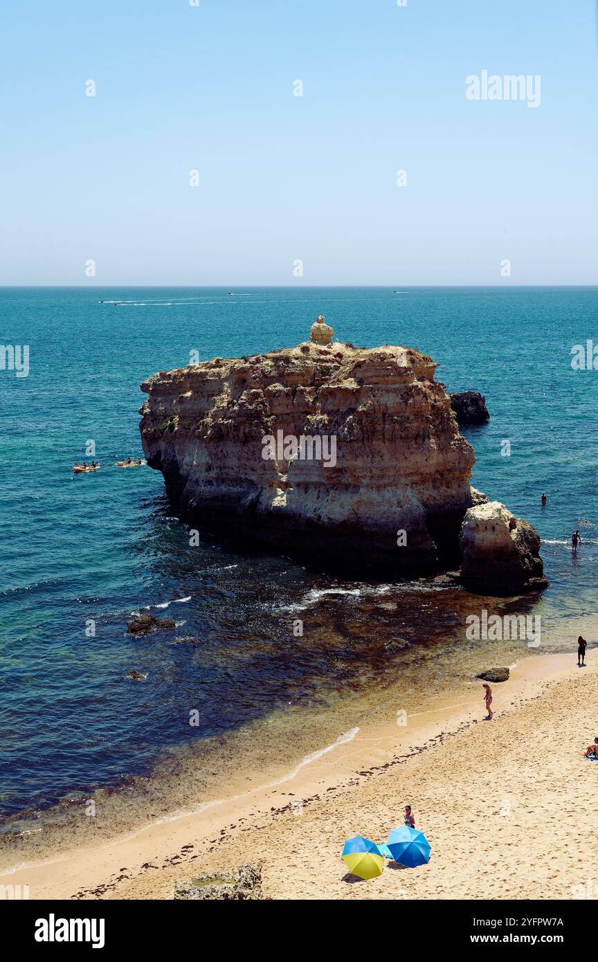 So Rafael Scenic rock formations rise from the blue waters of Praia de São Rafael ...