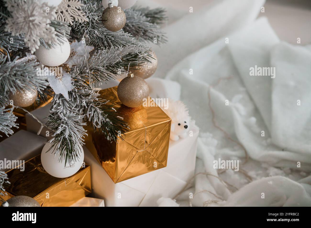 Cozy Holiday Scene with Christmas Tree, Gifts, and Soft Textiles Stock ...