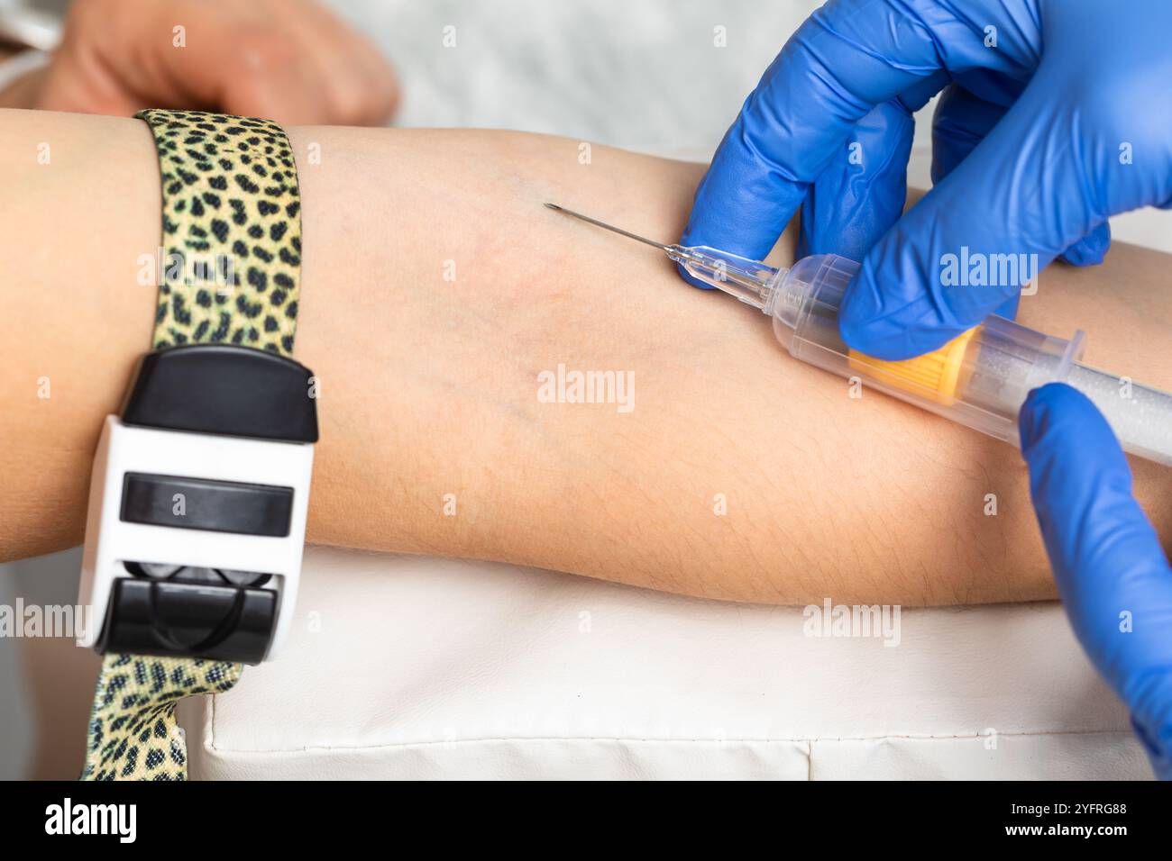 Close-up shot of healthcare worker wearing gloves ready to take a blood ...