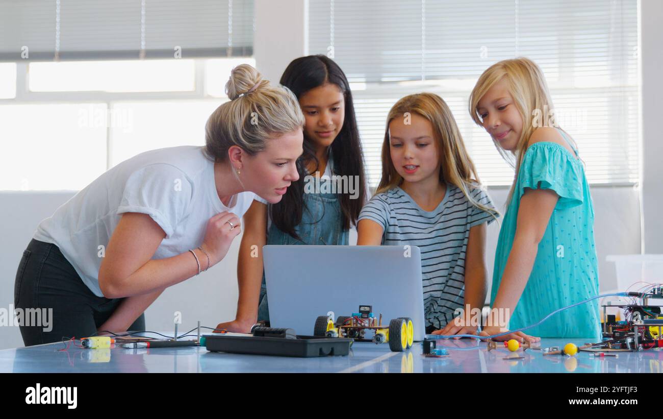 Female teacher students programming hi-res stock photography and images ...