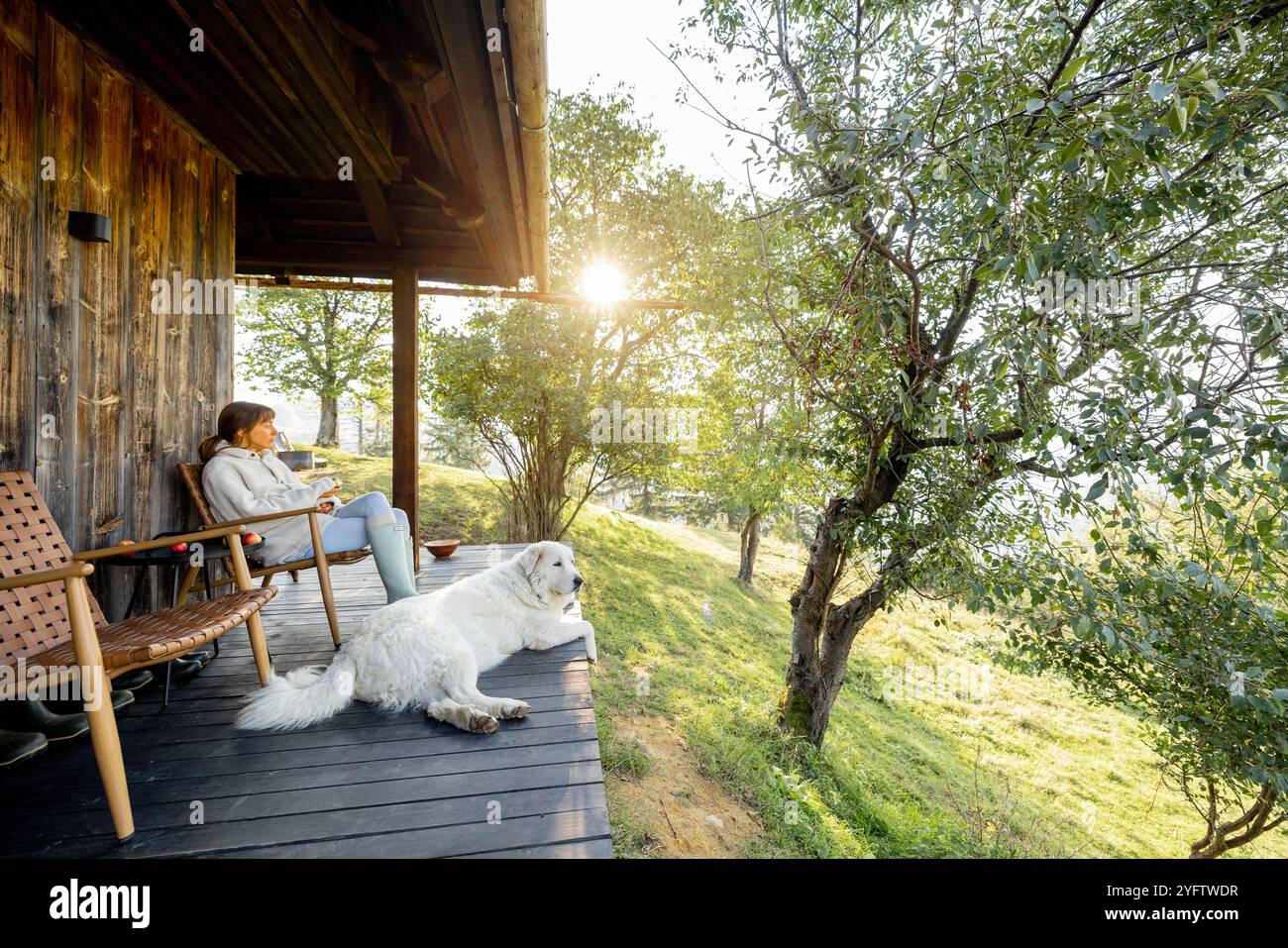 Relaxing on wooden porch woman hi-res stock photography and images - Alamy