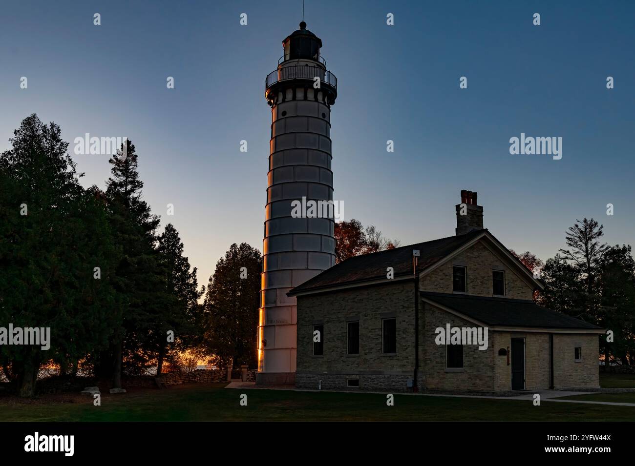 The Cana Island Lighthouse Is Lit On Its Lake Michigan Facing Side Just the-cana-island-lighthouse-is-lit-on-its-lake-michigan-facing-side-just