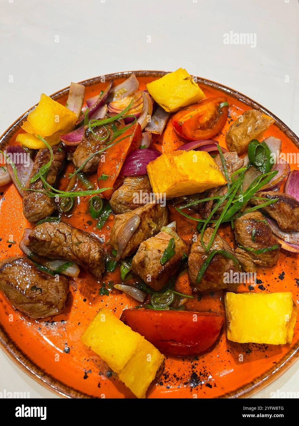 Lomo saltado, traditional dish from Peru. - Smartphone Captured Stock Image