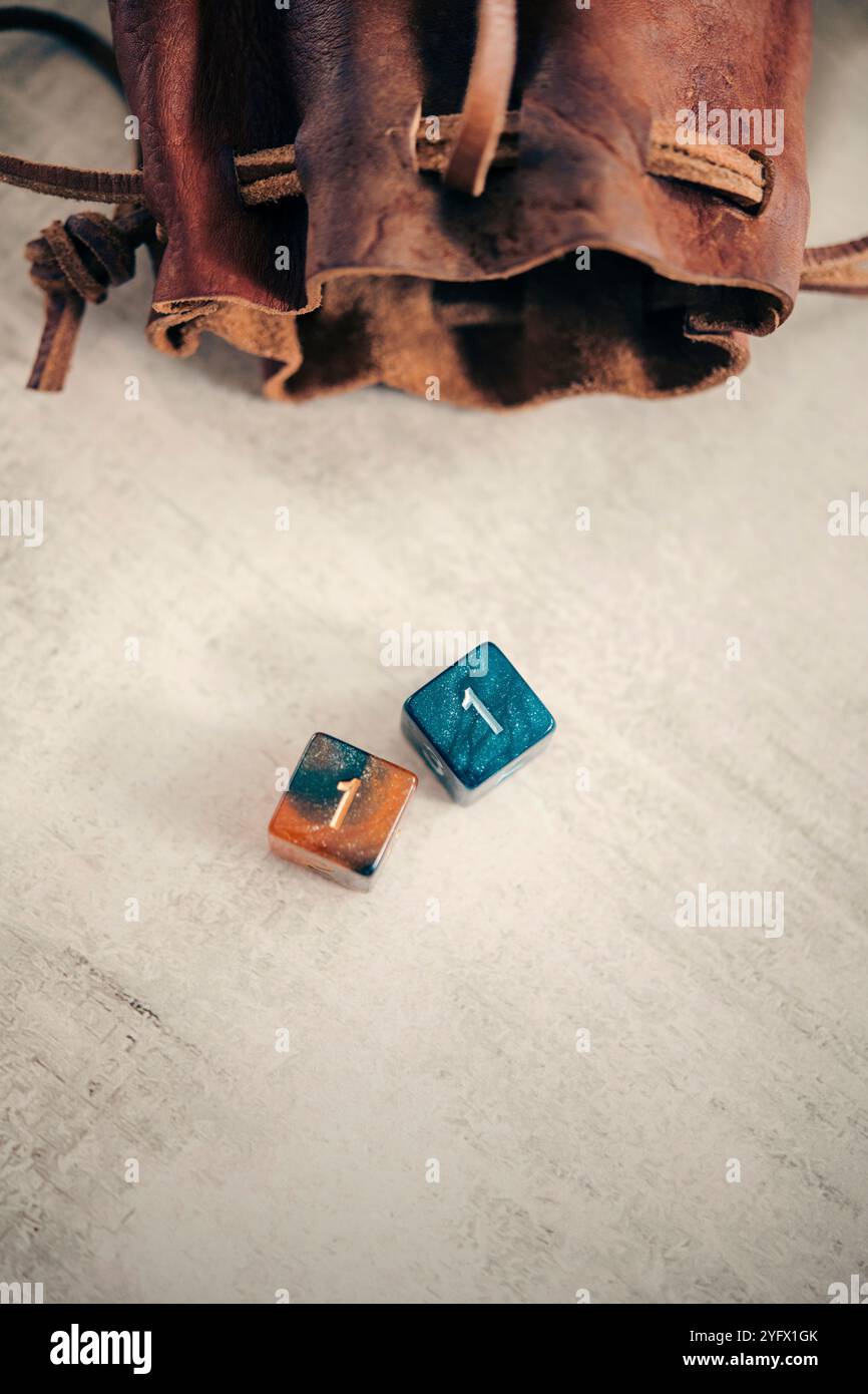 Still life of two six-sided dice with a dice bag Stock Photo