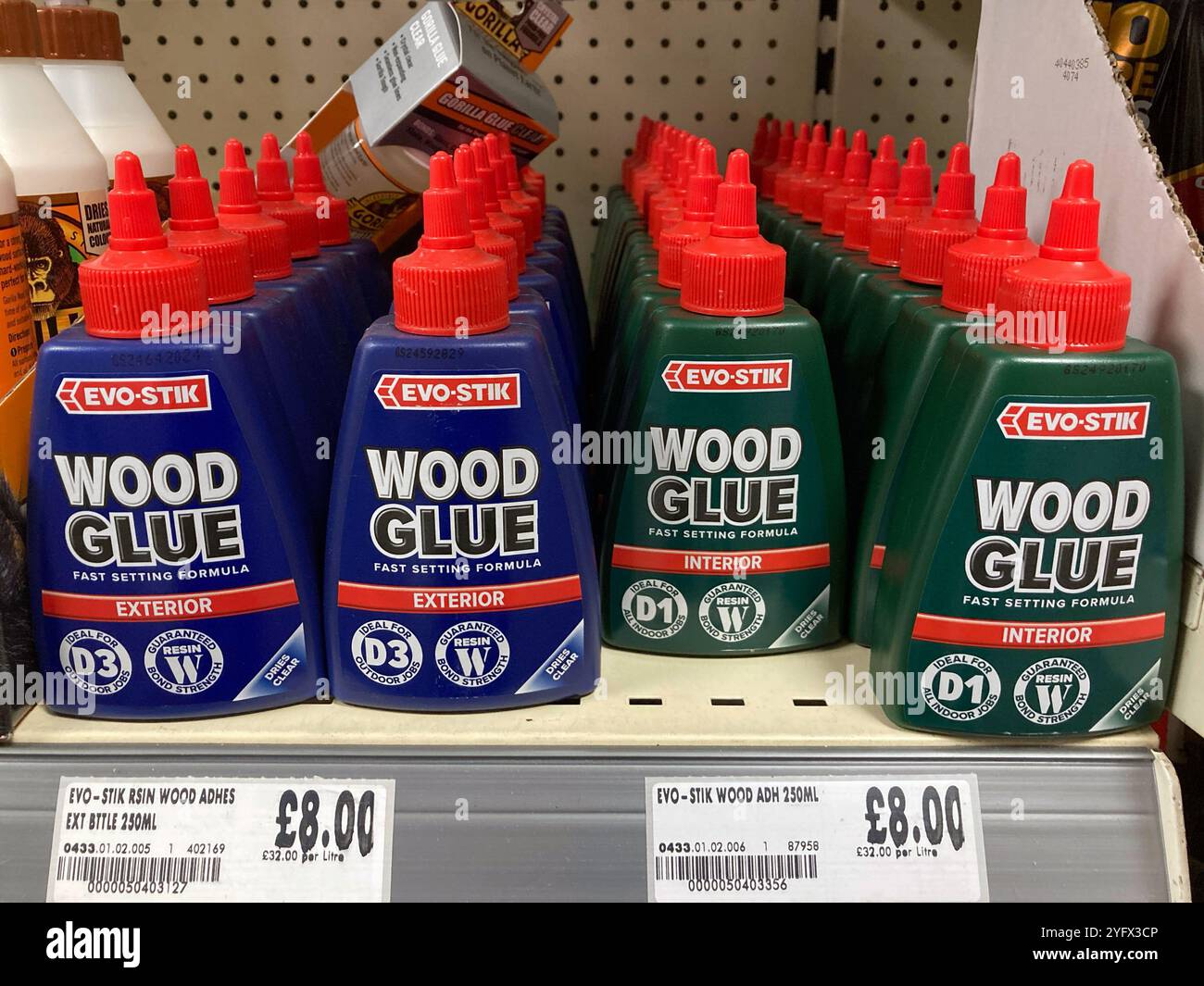 Choice of interior and exterior Evo-Stick Wood glue bottles at the local DIY store - Smartphone Captured Stock Image