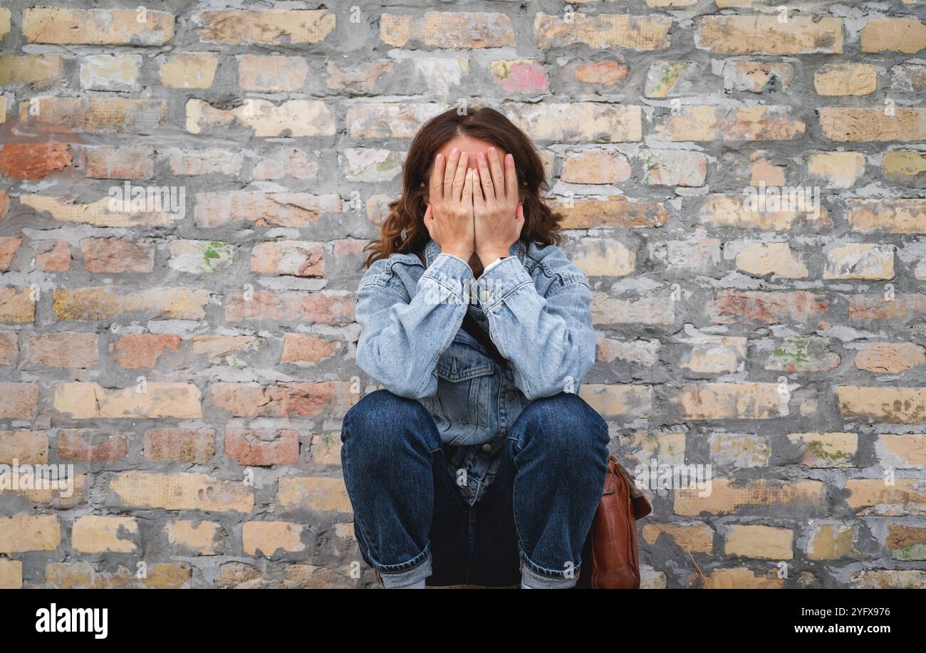 Woman crying hands face hi-res stock photography and images - Alamy