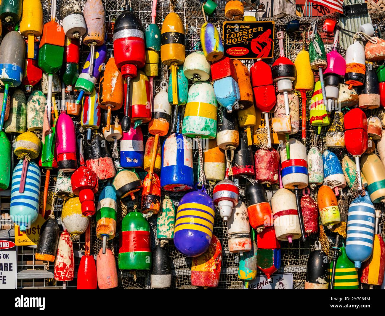 Lobster Trap Buoys on storefront in coastal tourist  town of Boothbay Harbor Maine Stock Photo