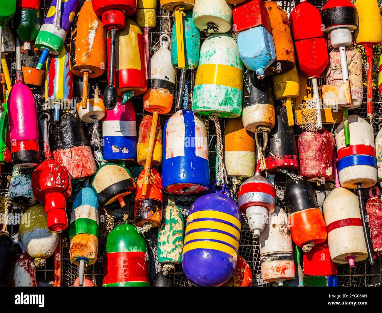 Lobster Trap Buoys on storefront in coastal tourist  town of Boothbay Harbor Maine Stock Photo