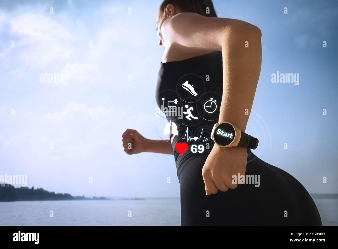 Woman with smart watch running near river outdoors, closeup. Low angle view. Icons near device Stock Photo