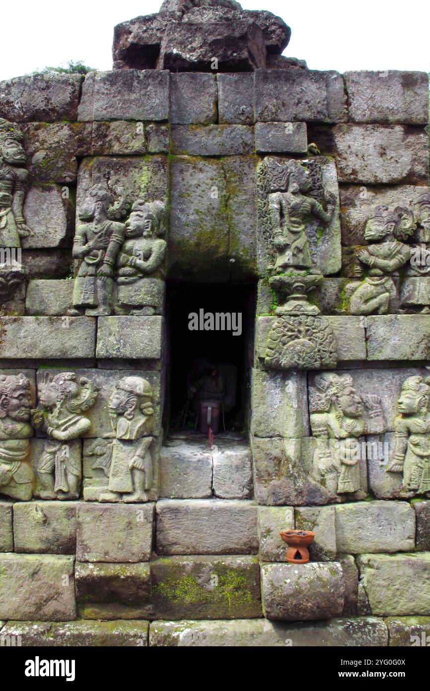 Bas-relief sculptures on wall at encased foot of Sukuh Temple, ancient ...