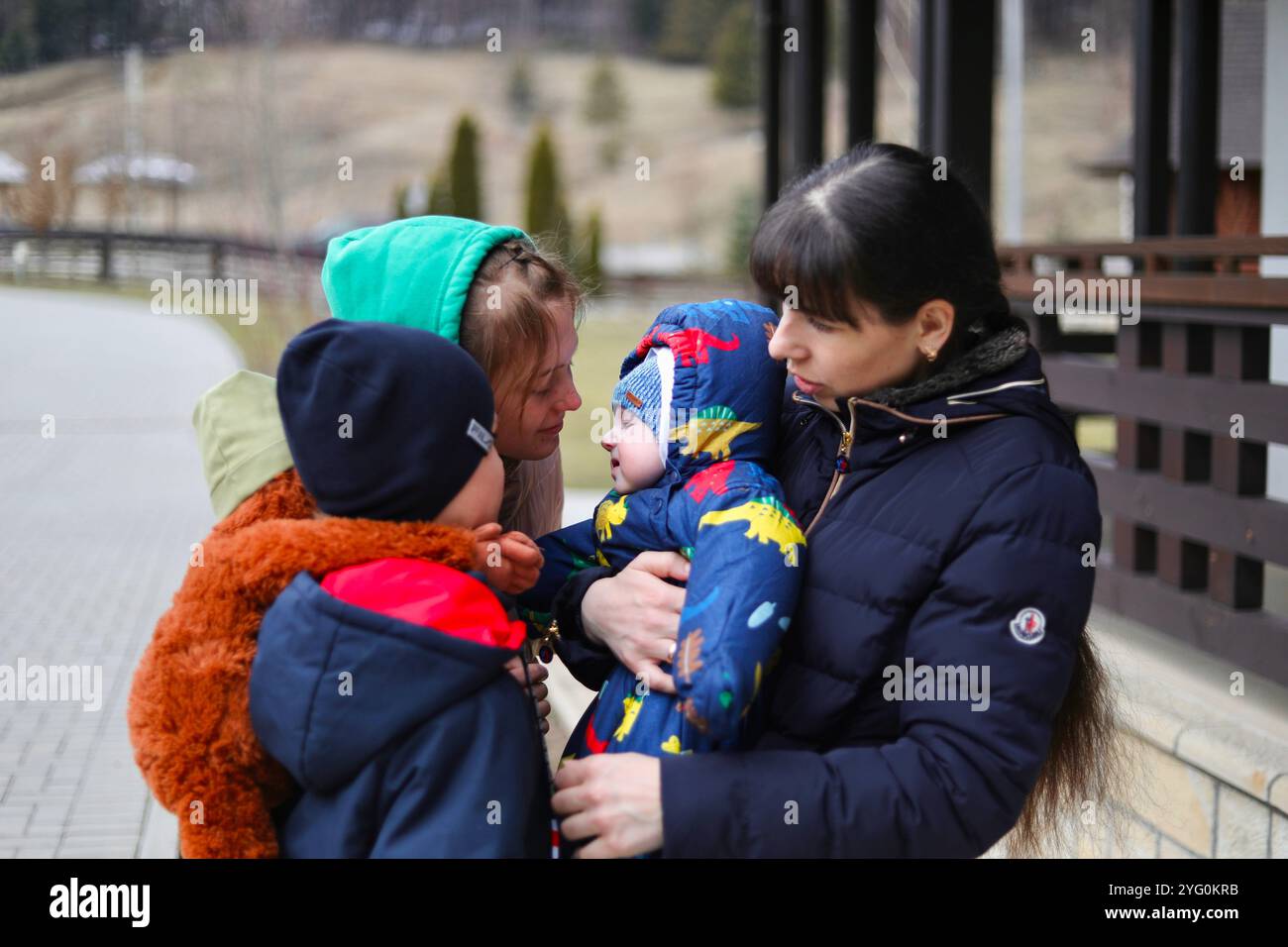 Iryna And The Children Get Some Fresh Air In Front Of The House iryna-and-the-children-get-some-fresh-air-in-front-of-the-house