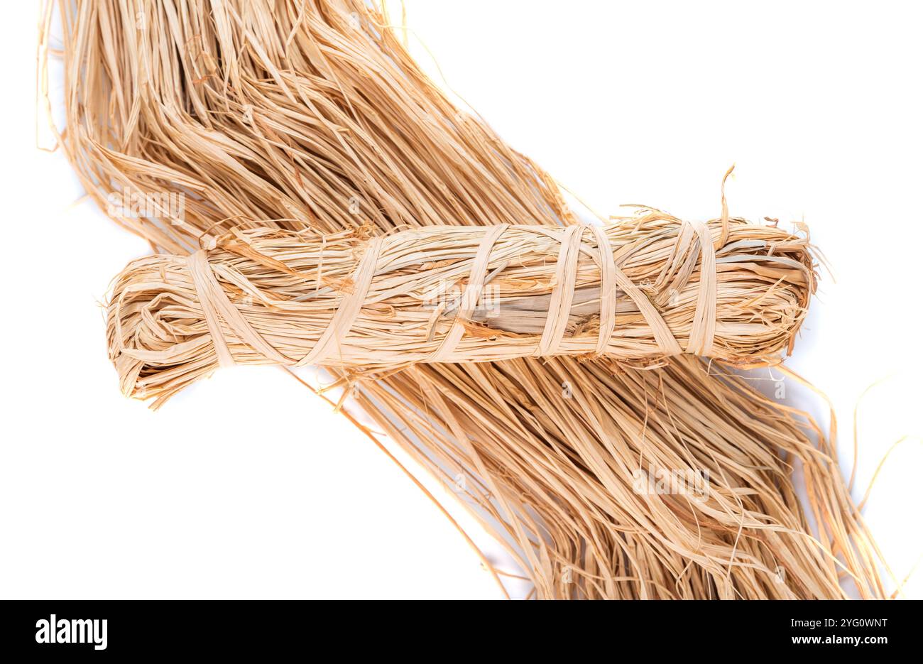 Raphia skein natural color on white background Stock Photo - Alamy
