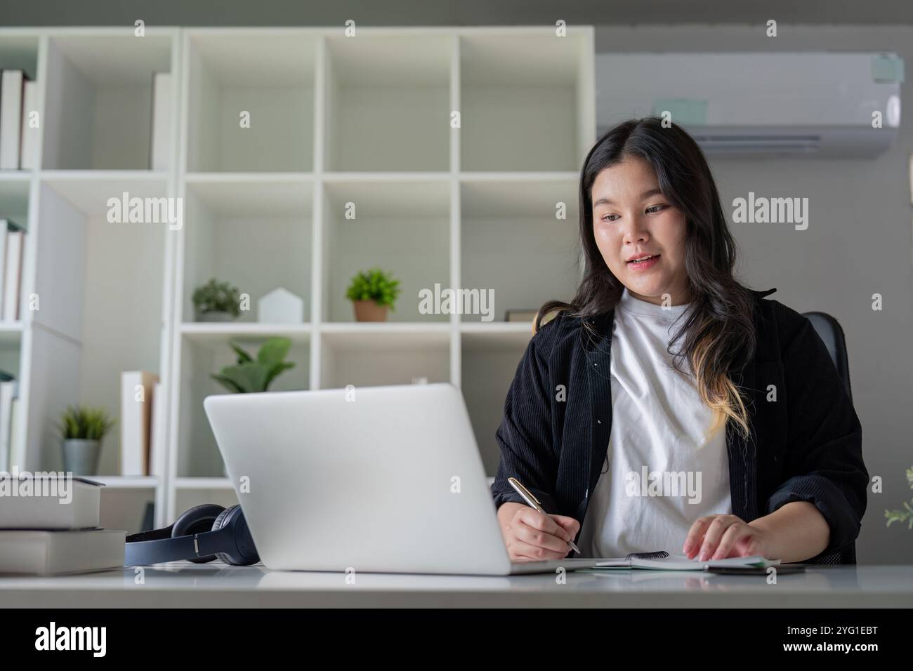 Overweight Office Assistant Engaging in Remote Collaboration for Diverse Teamwork Stock Photo