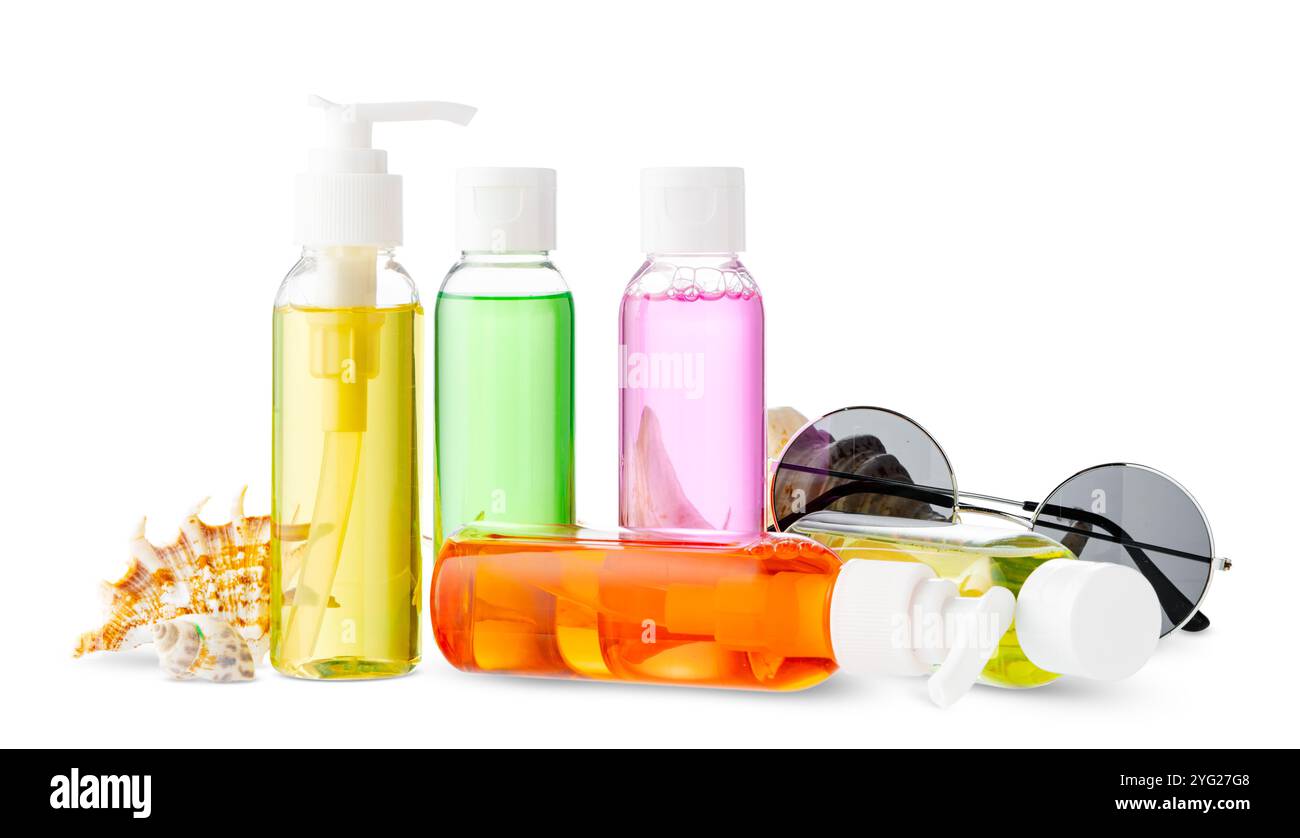 Assorted skincare products displayed on a white surface with a seashell Stock Photo