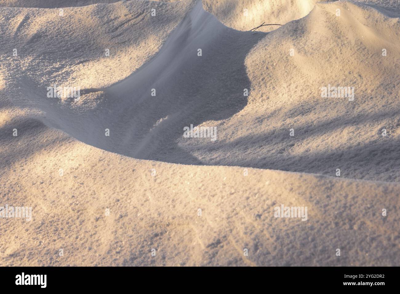 Shadow pattern on a snowdrift a cold winter day Stock Photo