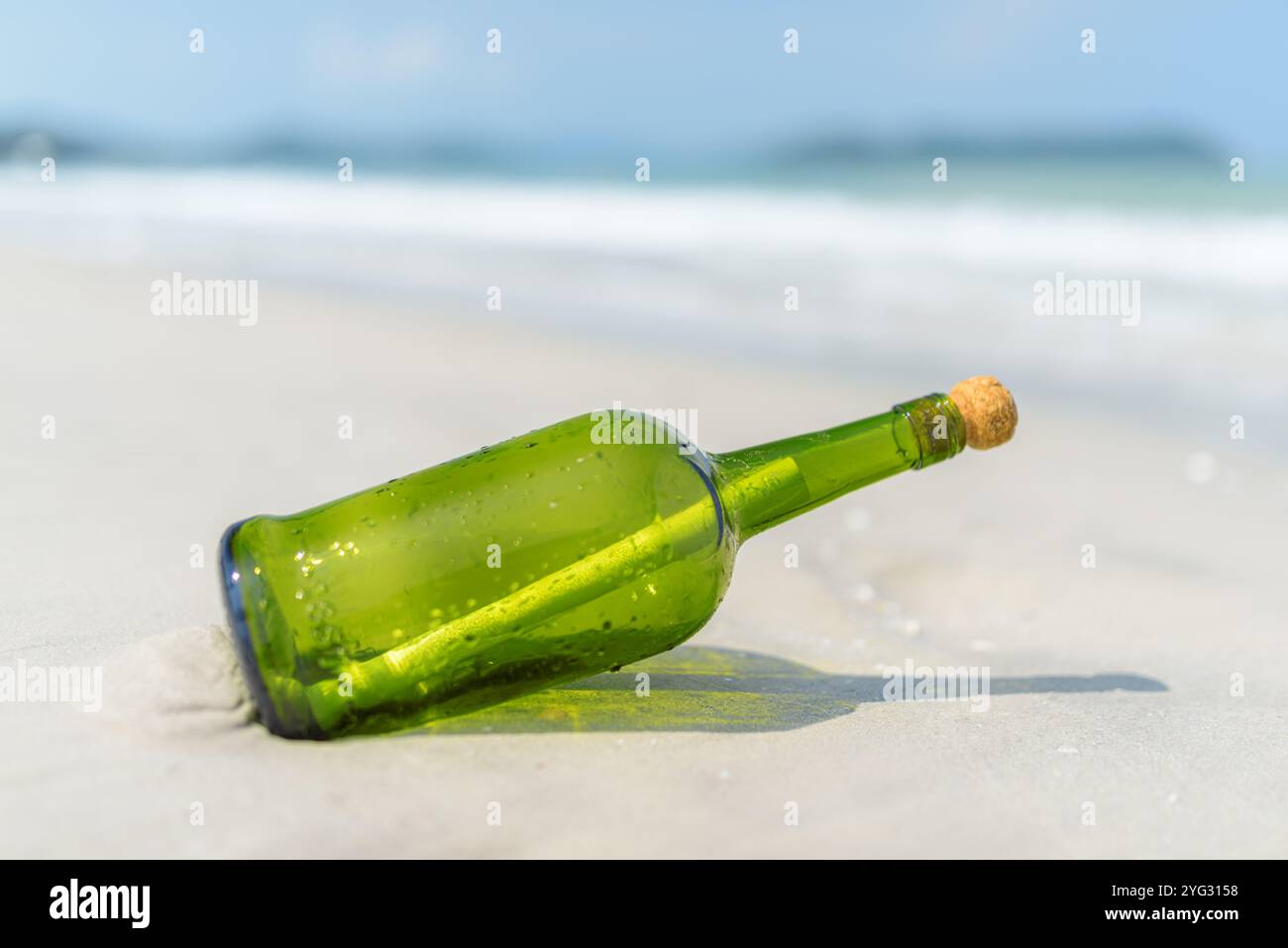 Message in a bottle (MIB) on a sand beach Stock Photo