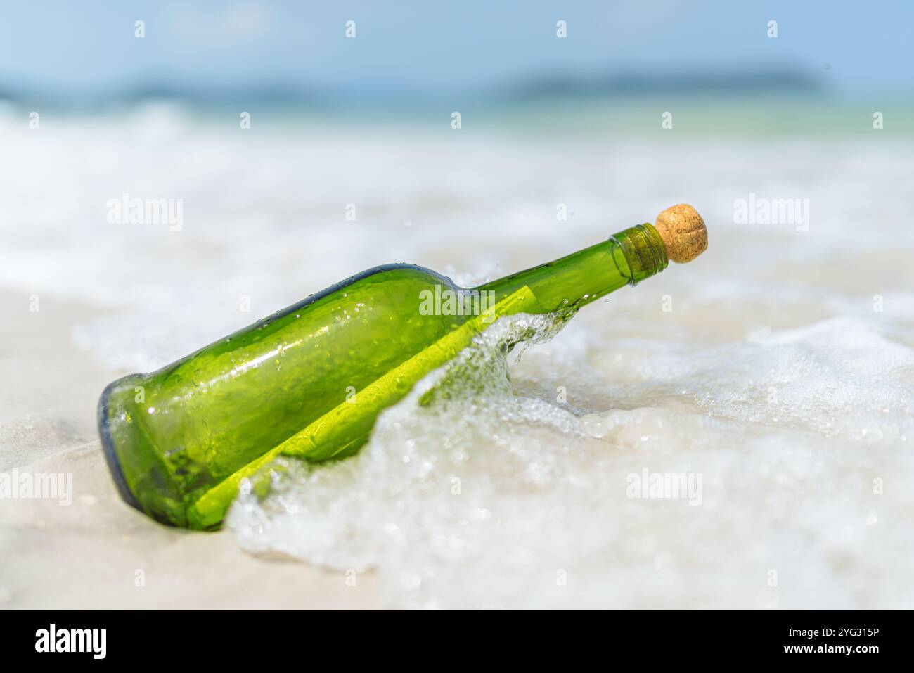 Message in a bottle (MIB) on a sand beach Stock Photo