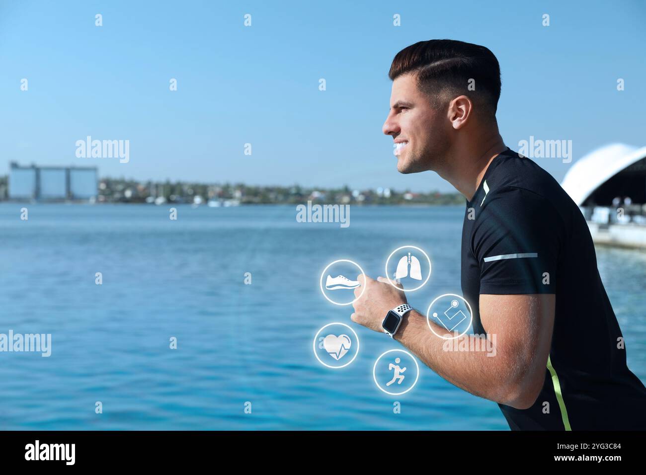 Man with smart watch running near river outdoors. Icons near device Stock Photo