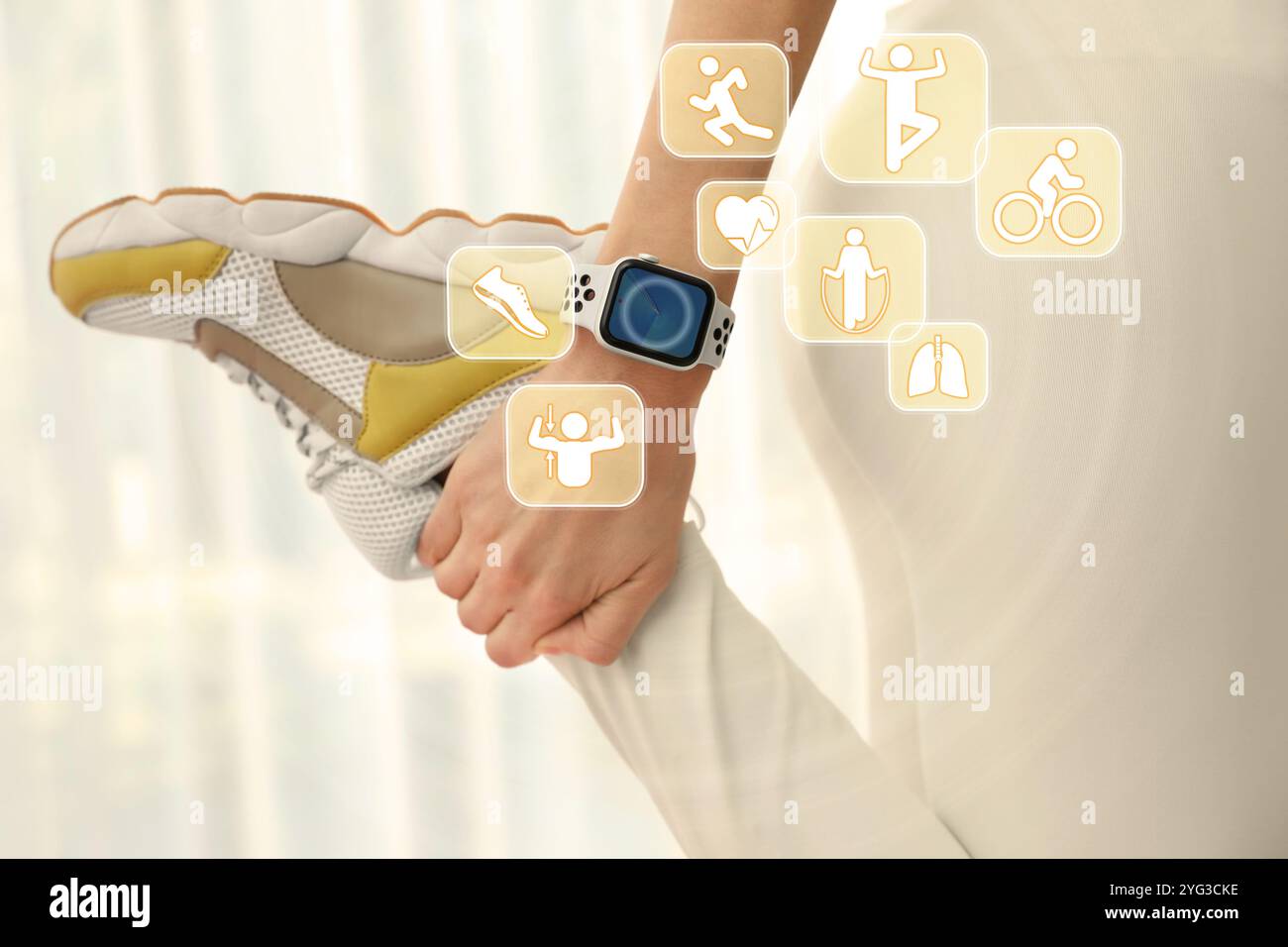 Woman with smart watch during training indoors, closeup. Icons near device Stock Photo