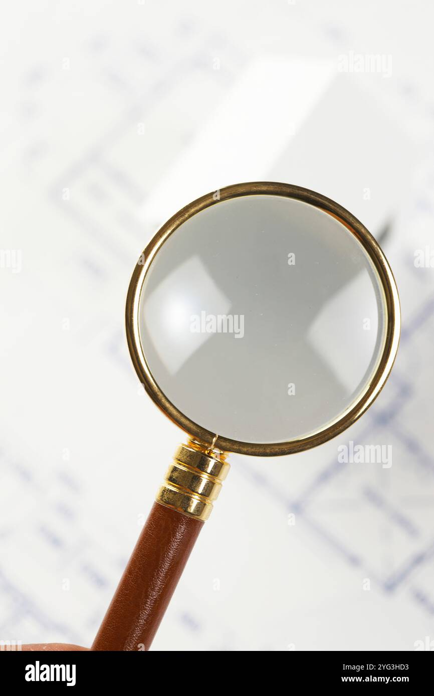 Loupe and blueprints Stock Photo - Alamy