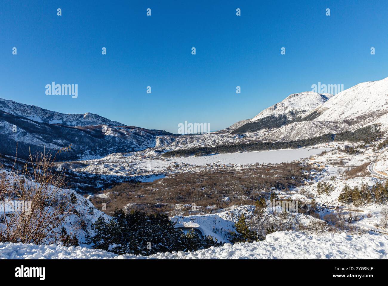 Snowy Landscape Overlooking a Mountain Village Stock Photo - Alamy