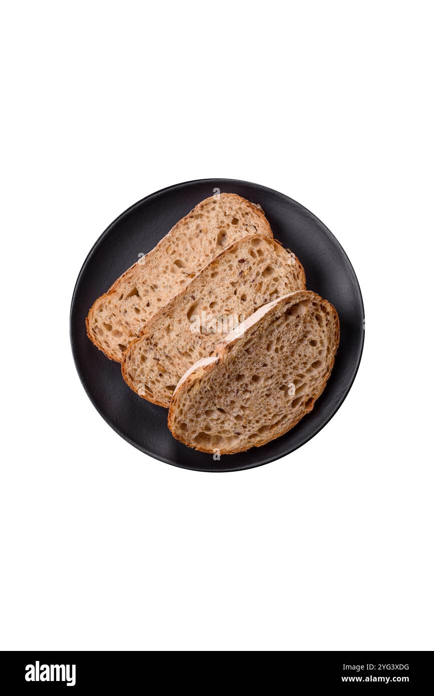 Brown bread with seeds and grains for sandwiches on a white background ...