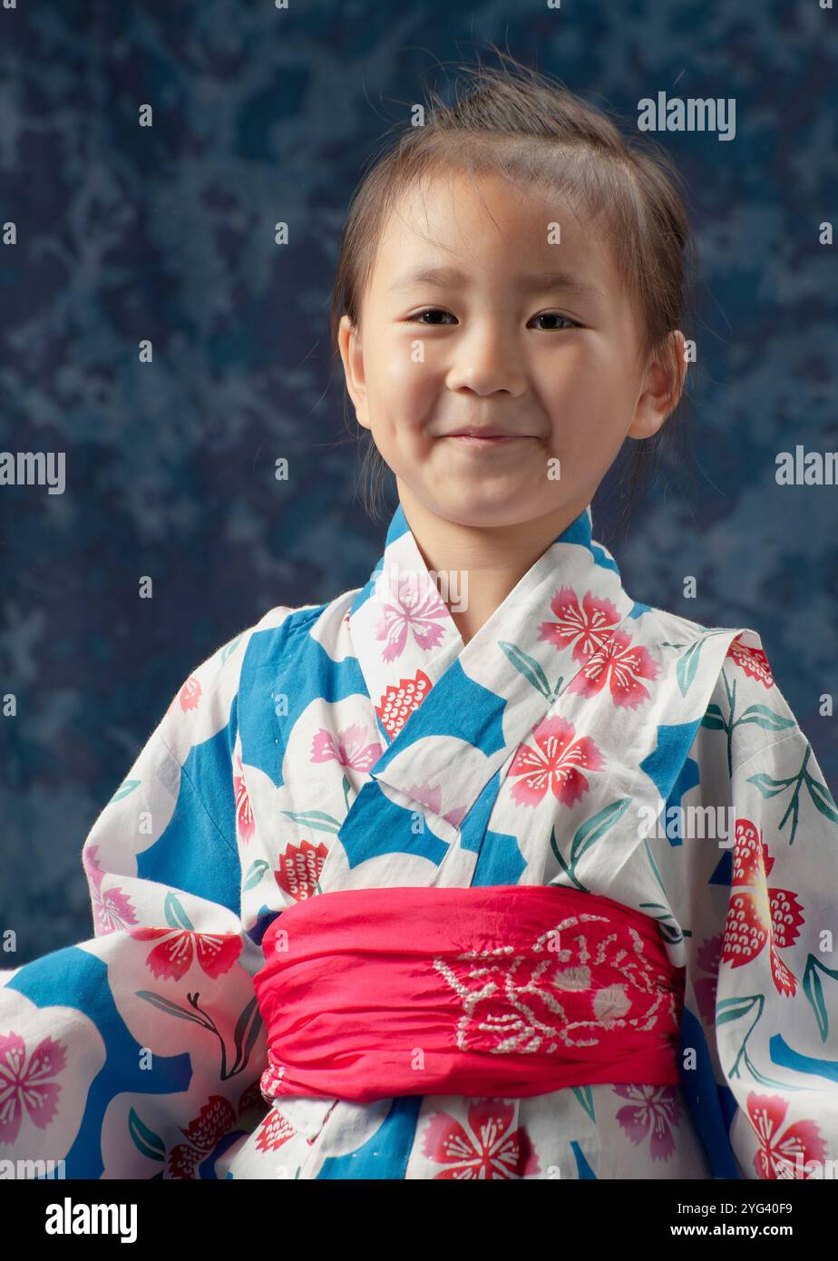Half-length portrait of a girl laughing in a yukata Stock Photo