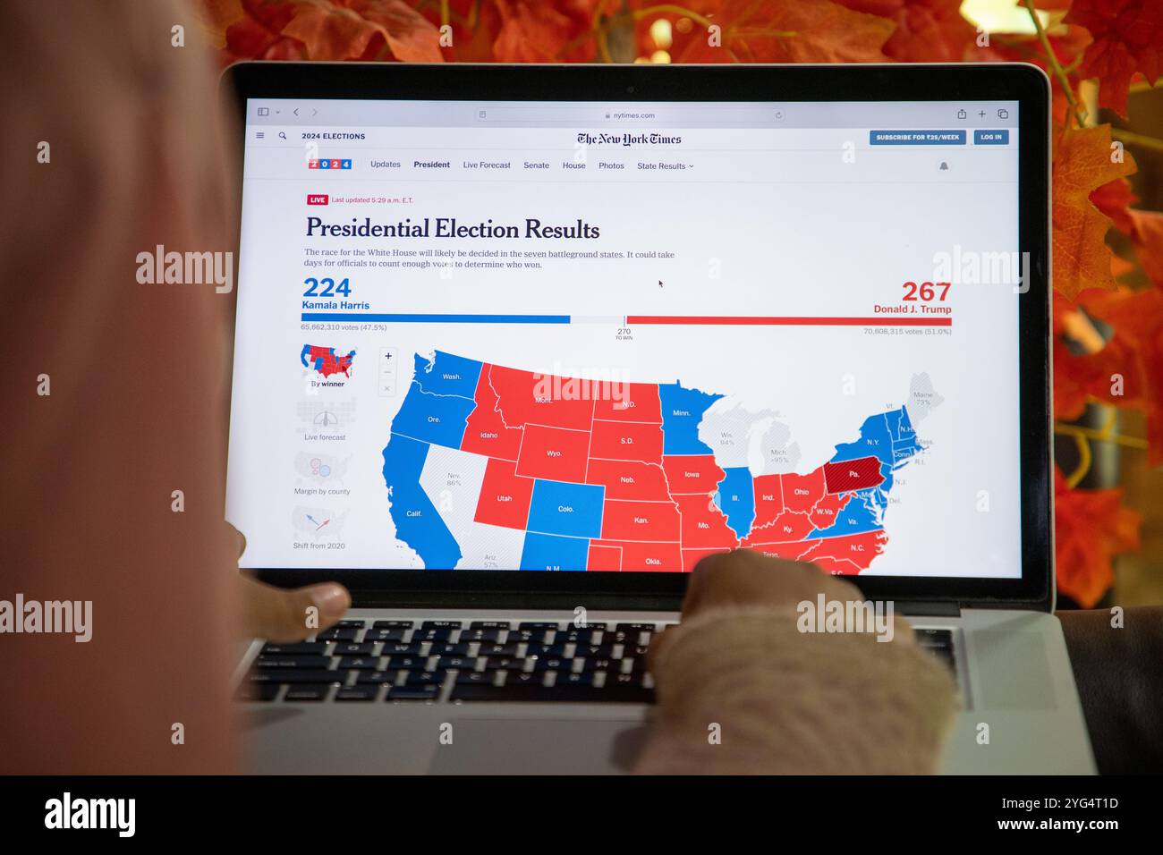 Recent Voting A girl looks at The New York Times Newspaper website on her laptop as ...