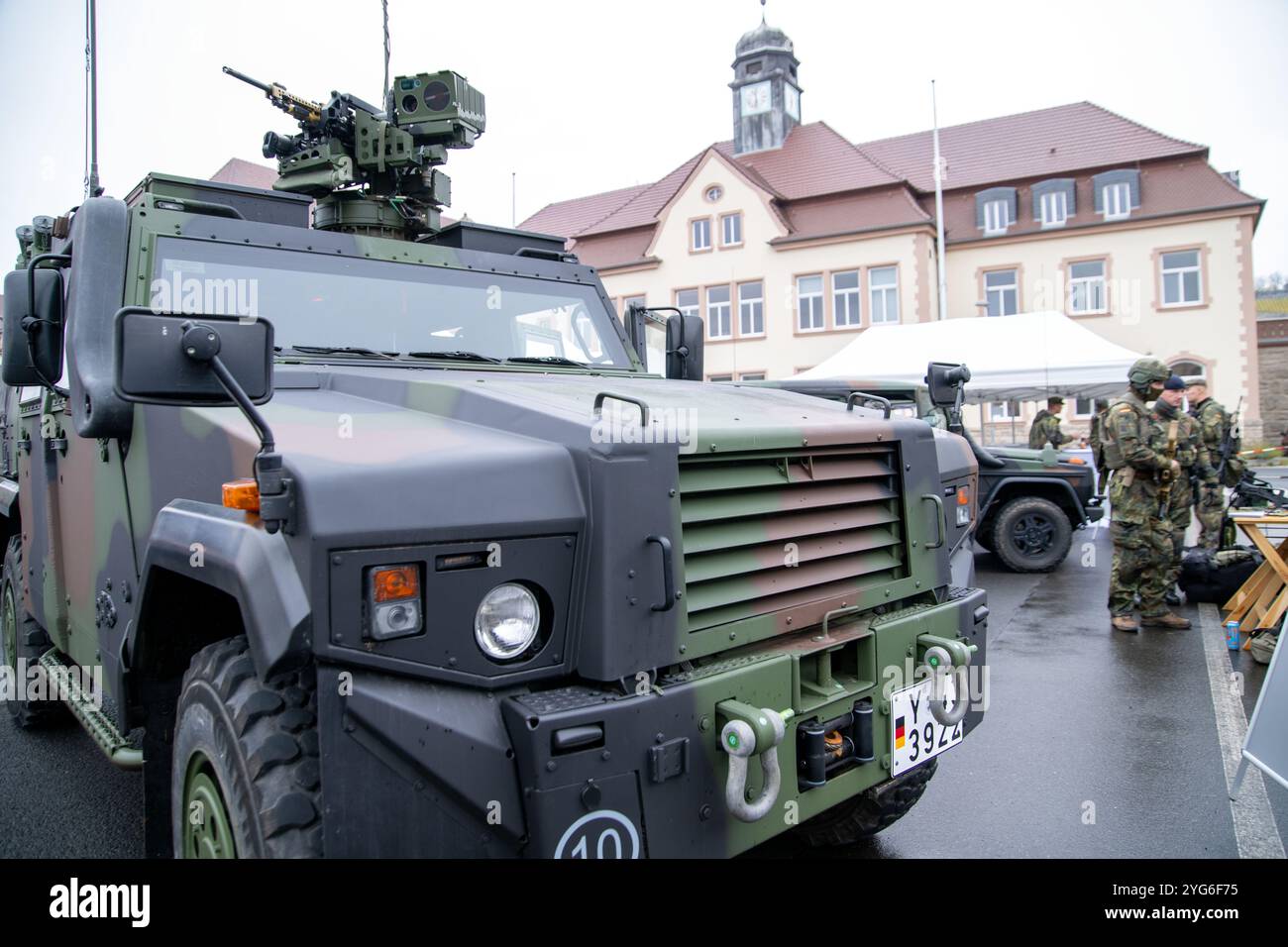 06 November 2024, Bavaria, Würzburg: A Bundeswehr vehicle with weapons ...