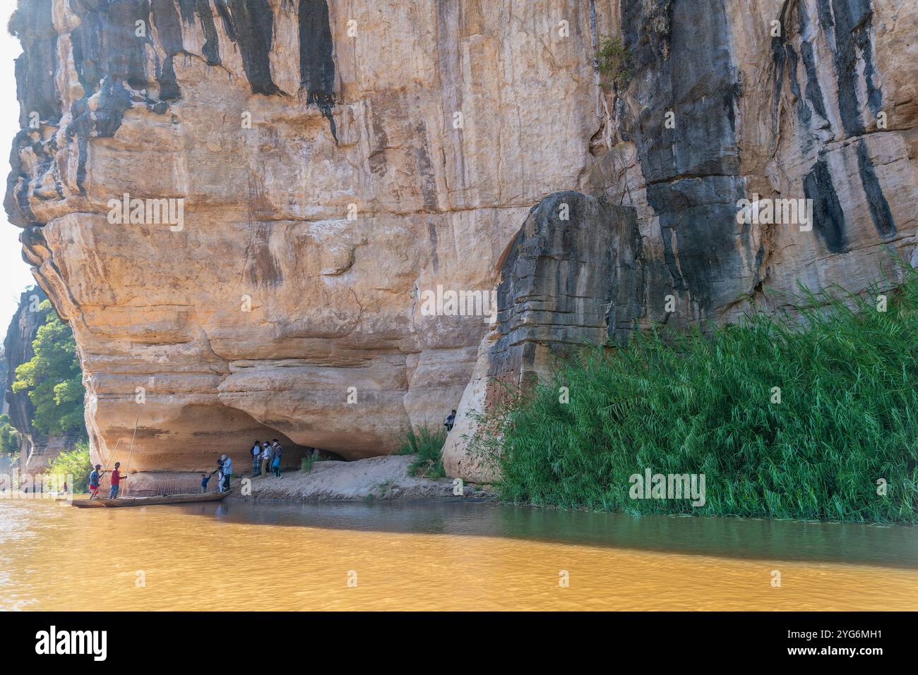 Manambolo River, Madagascar - August 28, 2024: Local guides lead tourists on a limestone adventure. Unique rock formations shaped by the river. Stock Photo