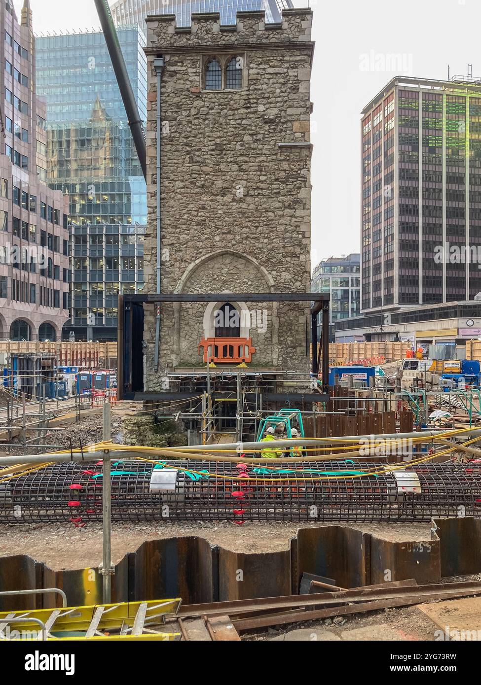 Historic Grade I listed All Hallows Staining church tower surrounded by excavation works during redevelopment of the area. City of London, UK - Smartphone Captured Stock Image