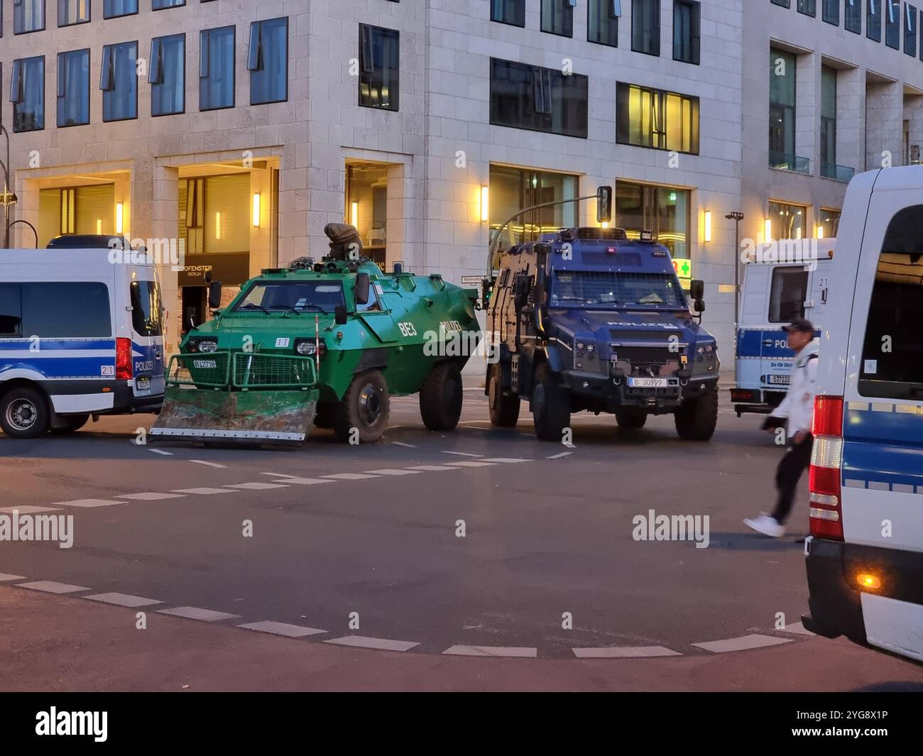 Armoured vehicles (police & military) in centre of Berlin Germany, in front of the Waldorf Astoria hotel, where president Zelensky stayed for URC2024 - Smartphone Captured Stock Image