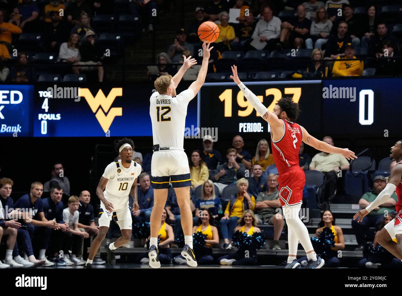 Morgantown, West Virginia, USA. 4th Nov, 2024. November 4, 2024: Tucker DeVries #12 and Ryan Prather Jr. #2 during the West Virginia University Mountaineers vs. Robert Morris University Colonials at the WVU Coliseum in Morgantown WV. Brook Ward/Apparent Media Group (Credit Image: © AMG/AMG via ZUMA Press Wire) EDITORIAL USAGE ONLY! Not for Commercial USAGE! Stock Photo