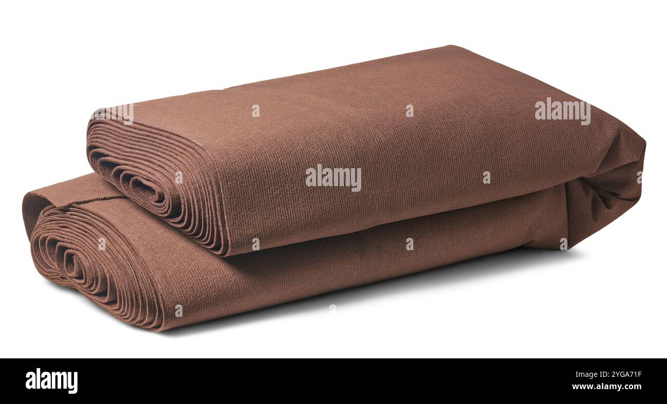 dark brown fabric floor carpet roll folded in half isolated white background, easy to handle, transport or store concept Stock Photo