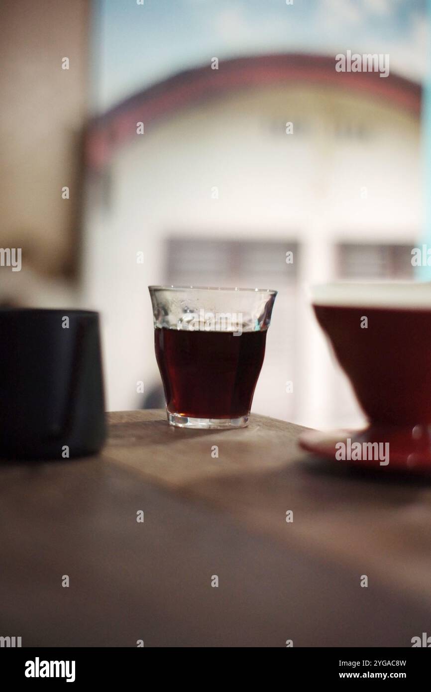 coffee beverage brewing method with the v60 technique, coffee is filtered with special paper so that coffee is produced without pulp Stock Photo